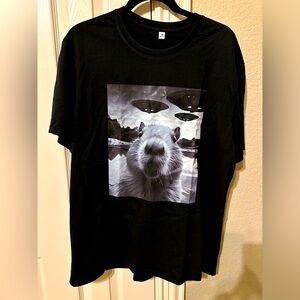 NWT funny novelty T-shirt flying saucers.  Black .  Marked 2x but closer to XL